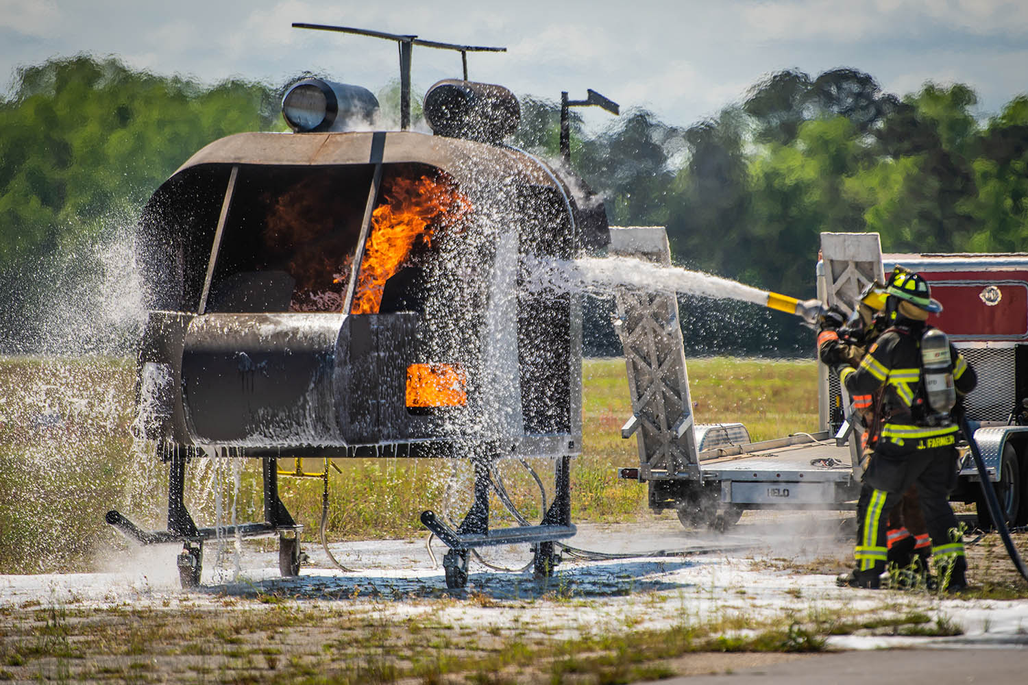 Auburn aviation disaster driller hosing down a helicopter on fire