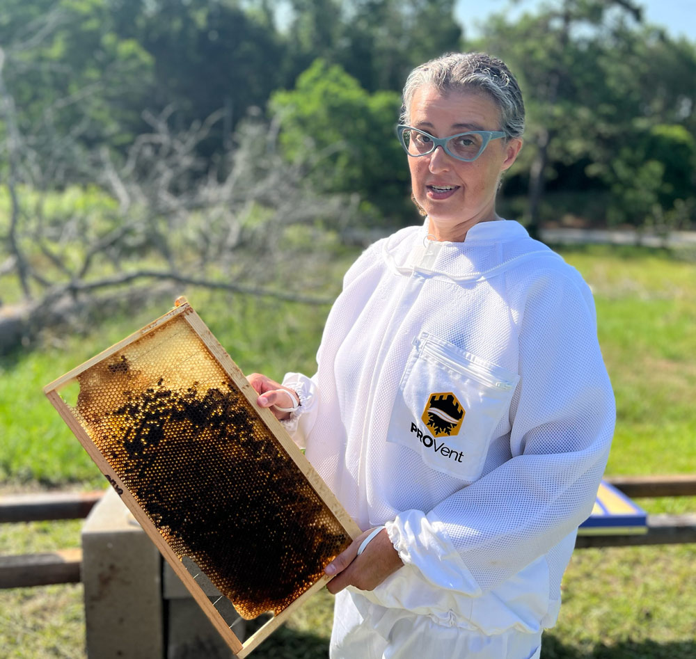 Becki Retzlaff holding up bee space