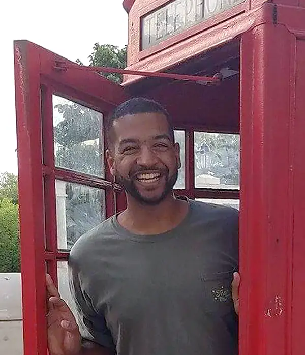 Isaiah Boaz in telephone booth