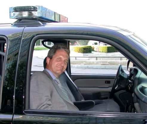 Alex Moore in security car at the UN
