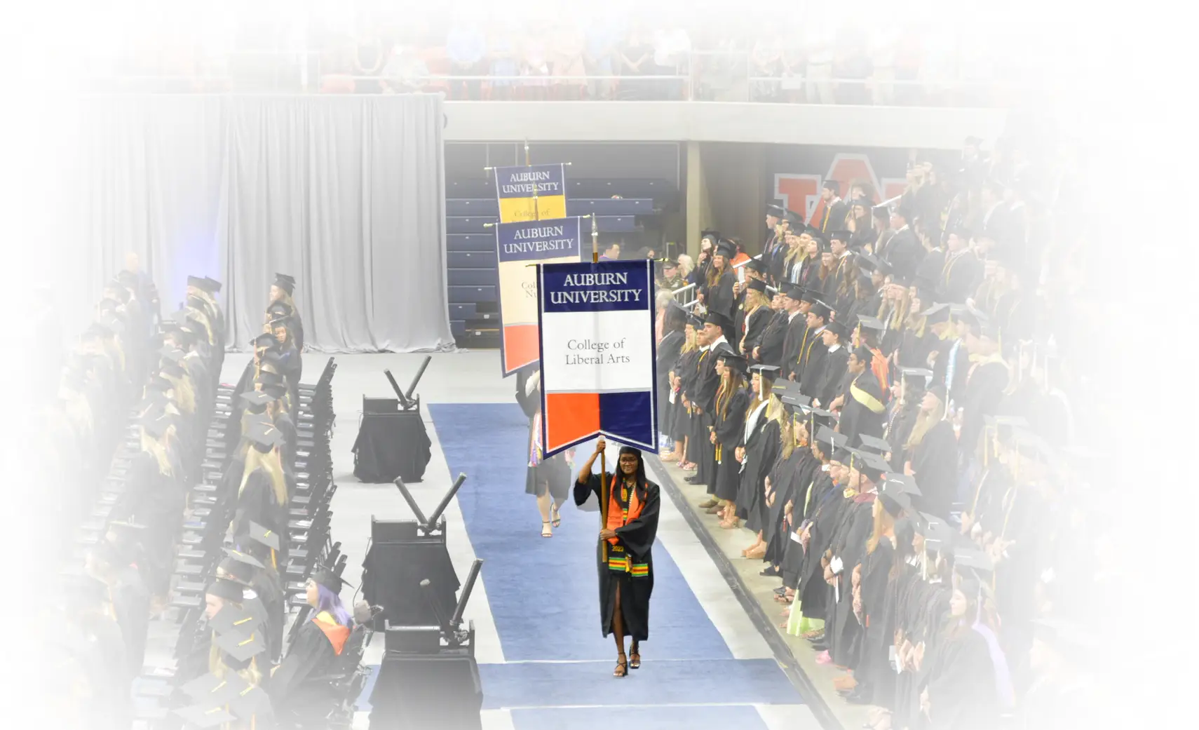 Diani walking as grad marshall at graduation