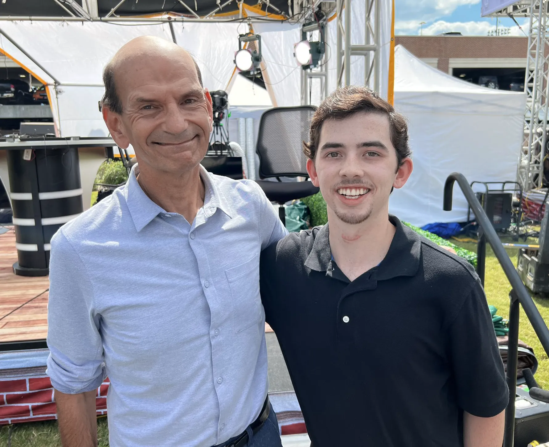 Noah Grifith smiling with Paul Finebaum with set in background