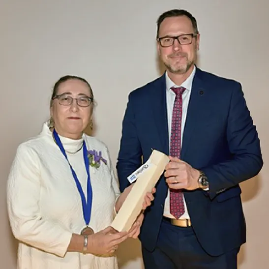 Endowed Alumni Professor of French Evelyne Bornier accepts the L’Ordre des francophones d’Amérique from Minister of the French Language Jean-François Roberge.
