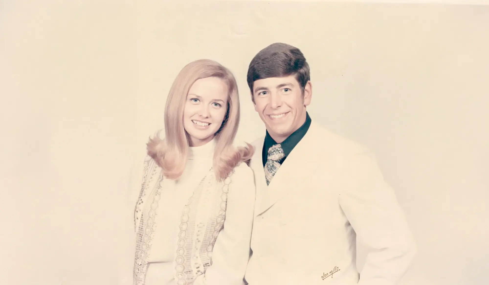 photo of Linda and Bill dressed in white in the 1970s.