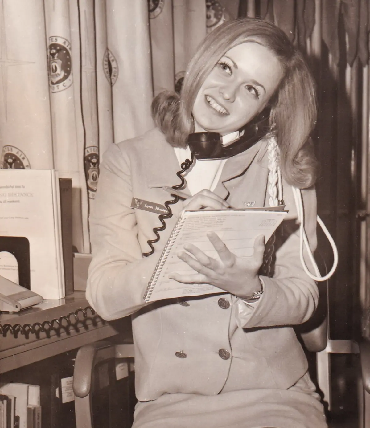 Linda in college on the Angel flight phone.