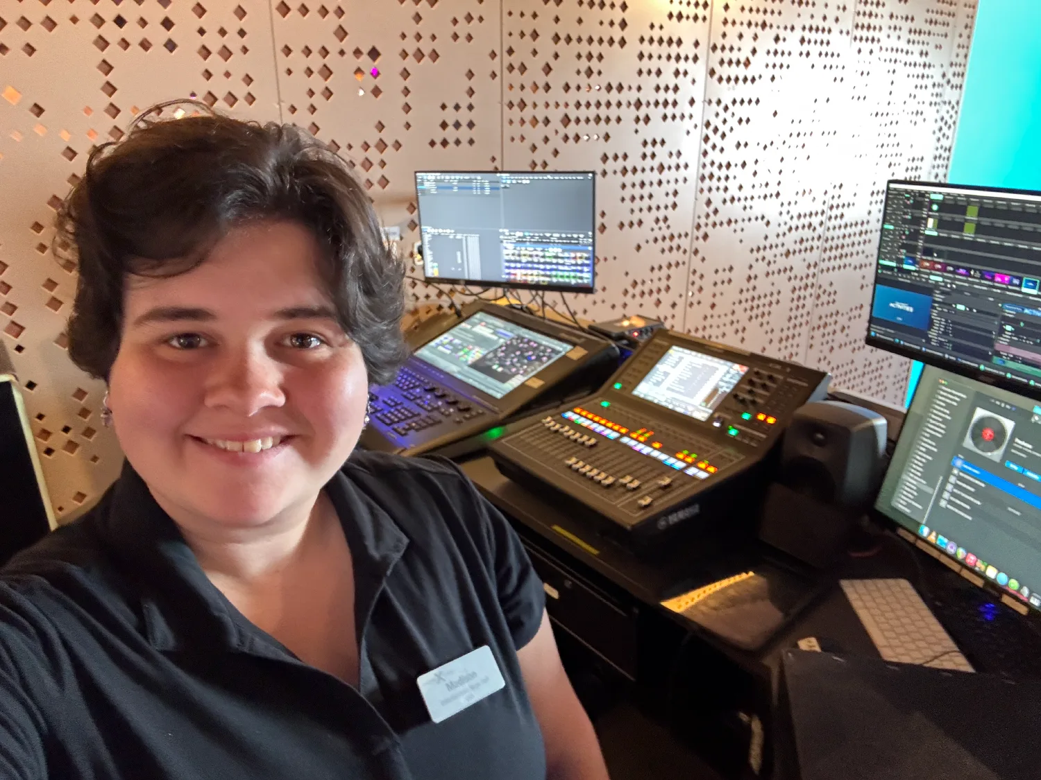 Madison backstage in the club venue on ship with AV control boards.