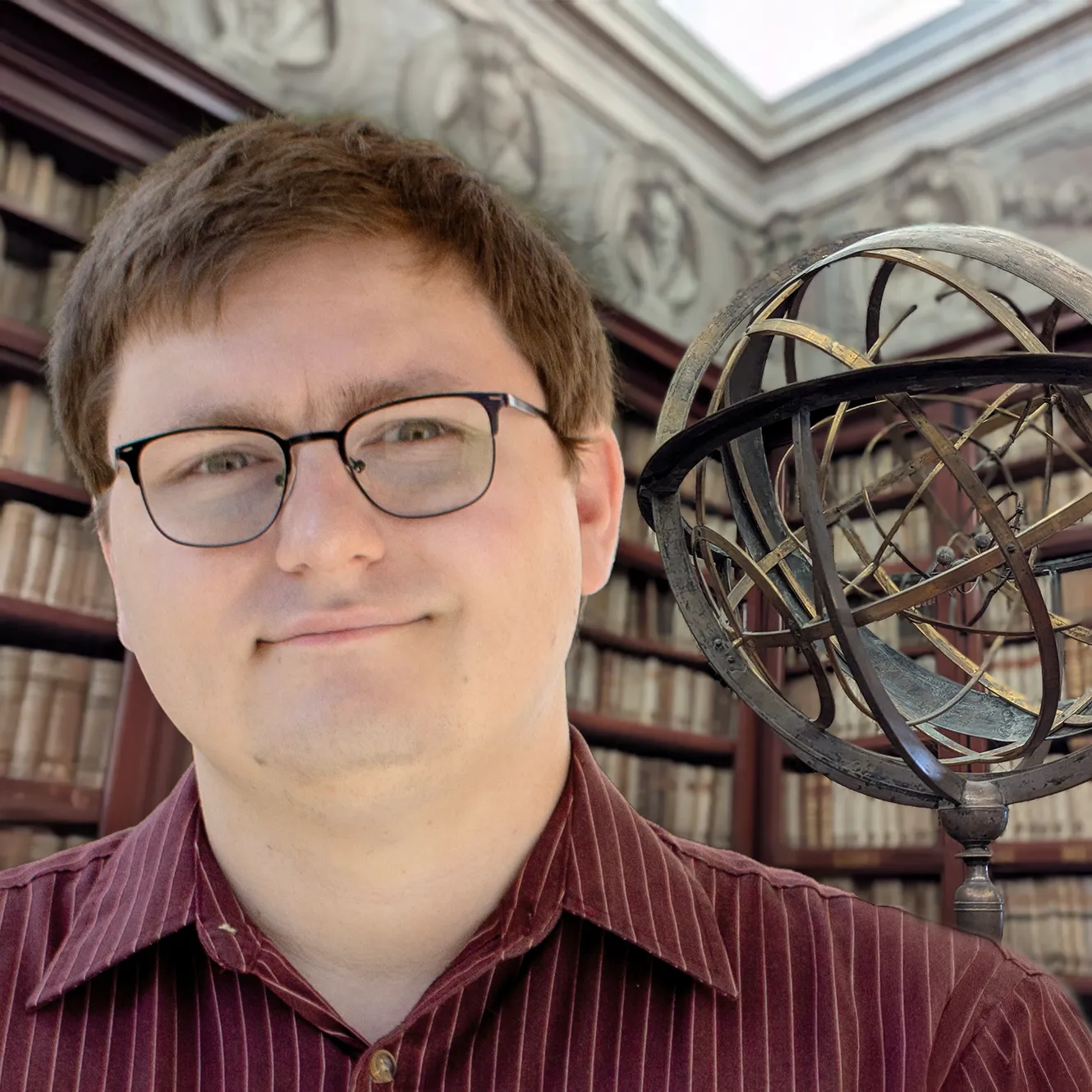 Jonathan Keller and globe in library in Rome